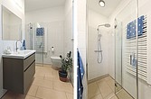 Bad mit bodenebener Dusche mit Glasabtrennung
