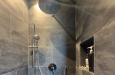 Die bodenebene Dusche mit eigenem Lichtkonzept